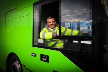 Mark Harper MP behind the wheel of a new zero emission bus
